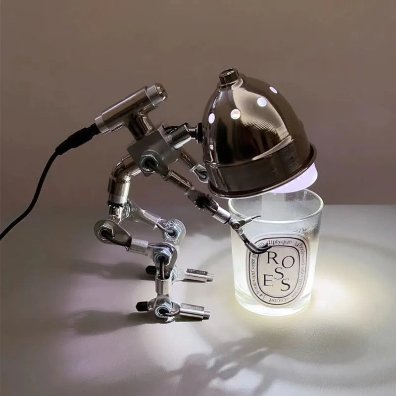 Silver and copper robot-shaped desk lamp with custom graphics in 22cm and 29cm sizes.