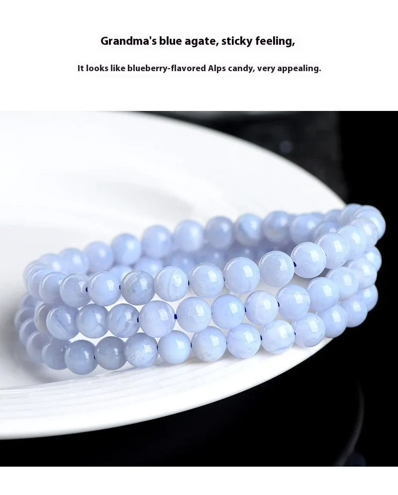 Close-up of a blue multi-circle patterned agate bead bracelet with 6-6.8mm beads and ruyi decorative elements.