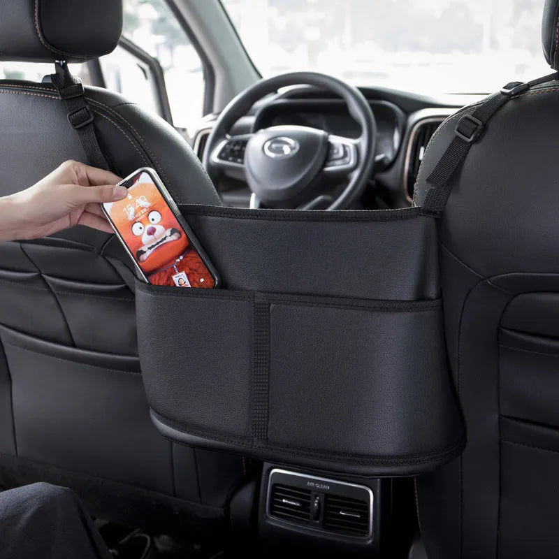 Black leather car seat storage bag with carbon fibre pattern measuring 38 by 24 by 15 centimetres