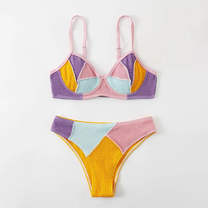 Women's spliced colour bikini set with steel push-up cups and matching shorts.