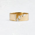 Gold electroplated women's ring with zircon detailing on a copper base, shown in size 8.