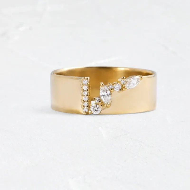 Gold electroplated women's ring with zircon detailing on a copper base, shown in size 8.