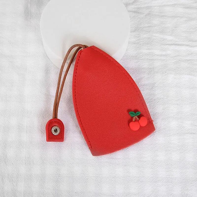 Cartoon PU leather pull-out car key case measuring 14 x 7.5cm with colourful designs