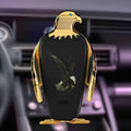 A black and gold wireless charging car phone holder with a suction cup mount, shown on a car dashboard.