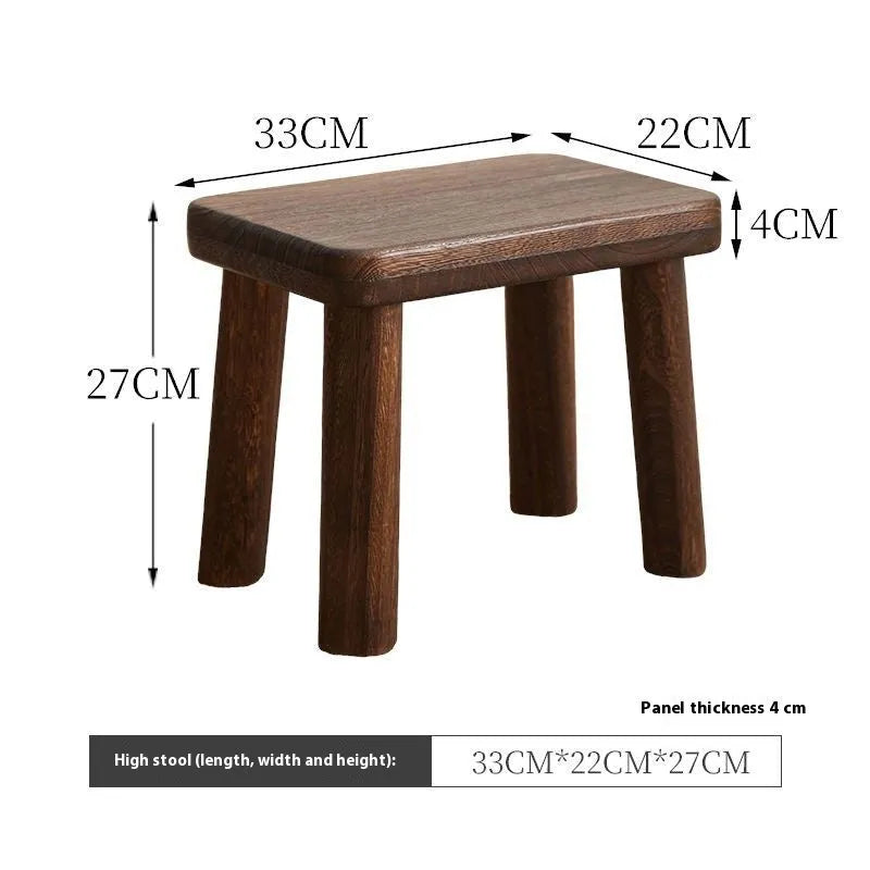 Solid wood household changing stool with a distressed wooden finish.