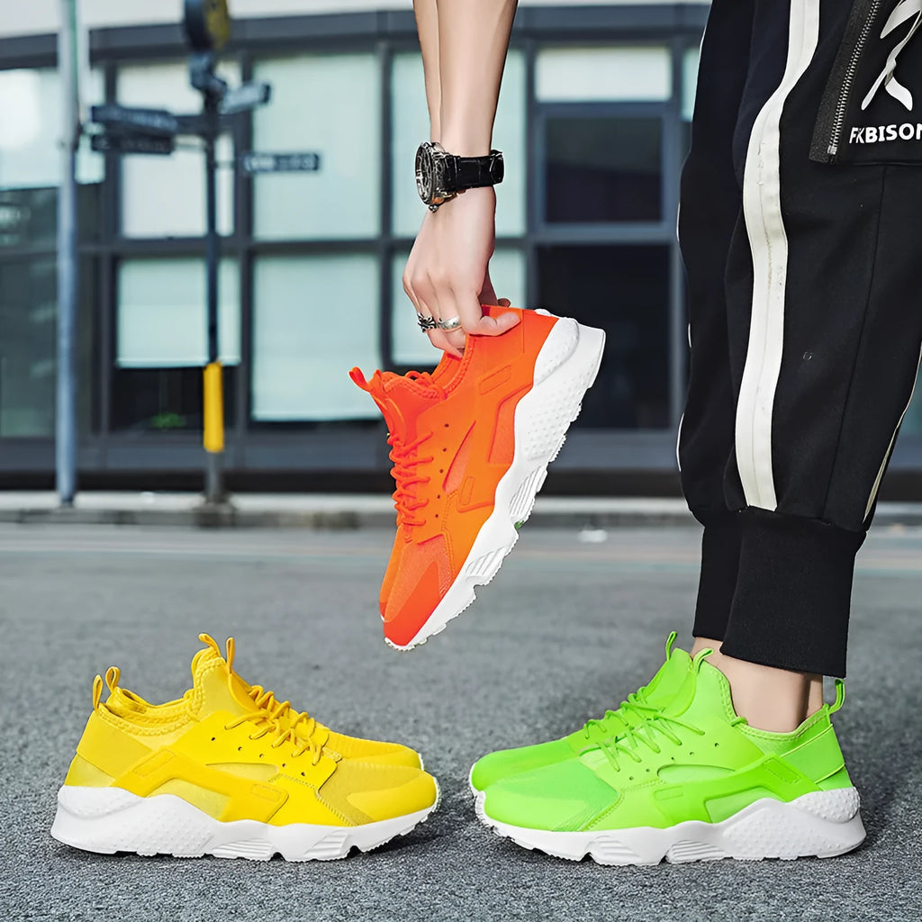 Men's low top lace-up casual trainers in fluorescent red with cross shoulder straps and mesh upper