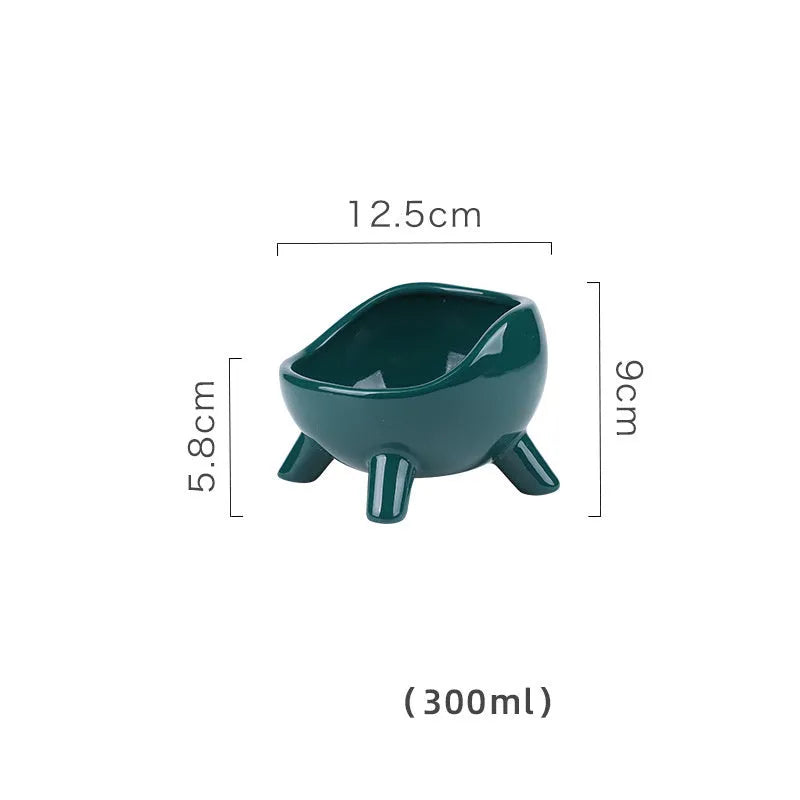Green ceramic pet bowl with four legs and wide opening for cat or small dog feeding