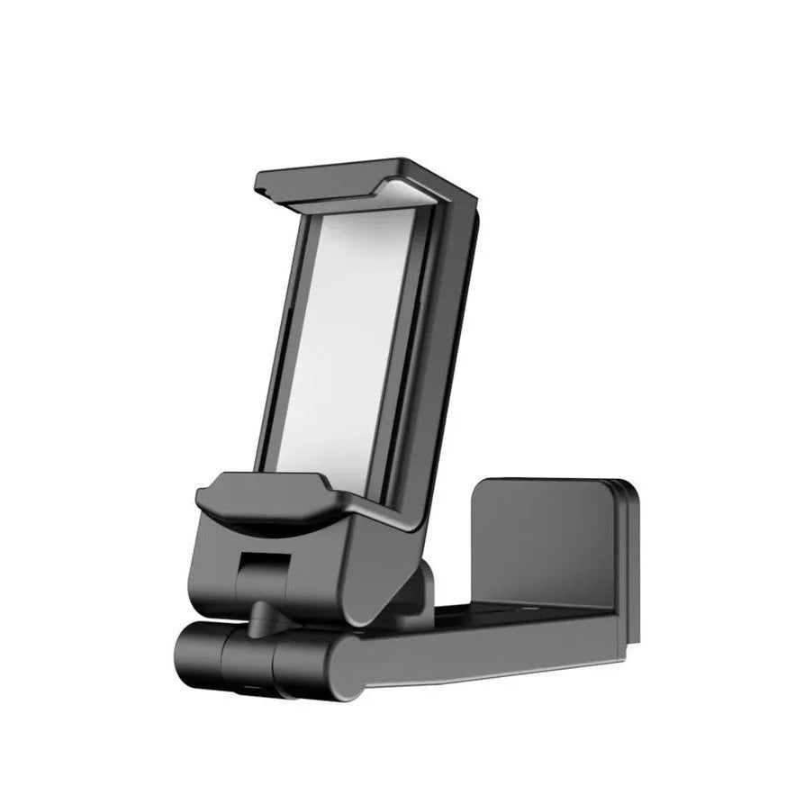 Black foldable rotating phone stand holding a mobile phone in landscape orientation on a desk.