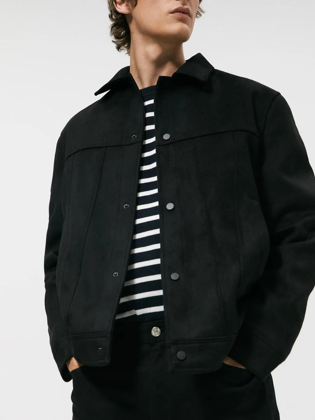 Black men's hooded jacket with a suede collar and side seam pockets on a hanger.