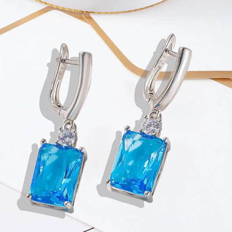 Square geometric copper earrings with electroplated gold finish showing quadrilateral shape design