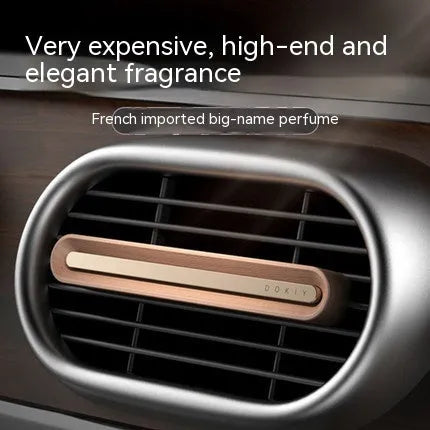 Car air vent aromatherapy ornament in long strip design, shown in walnut and metallic grey colour options