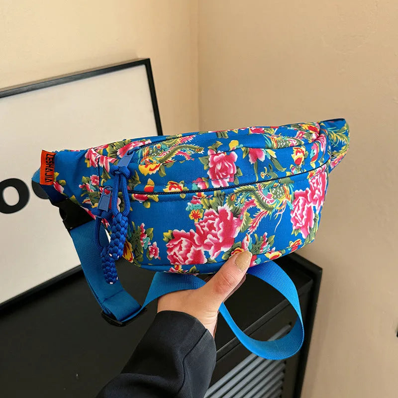 Women's western style waist bag with large floral decoration and contrast stitching