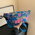 Women's western style waist bag with large floral decoration and contrast stitching