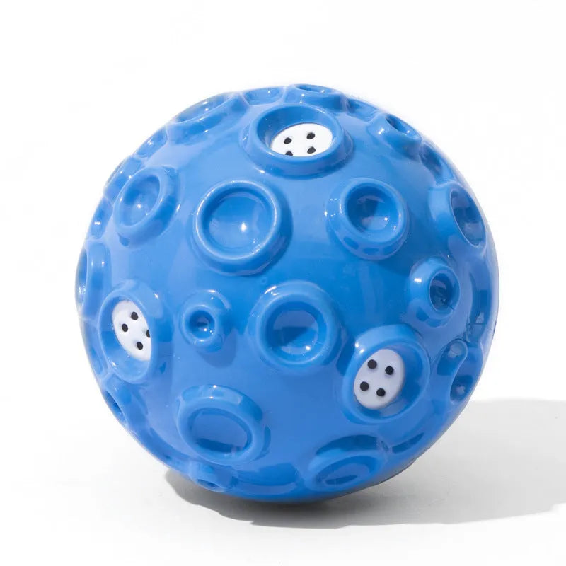 Colourful natural rubber dog chew ball with textured surface and meteorite-shaped bumps