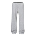Men's straight-leg casual cotton trousers in solid black colour showing loose fit design