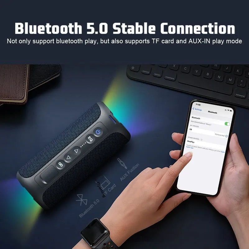 Black and blue fabric wireless Bluetooth speaker with colourful lighting effects showing 40W output rating