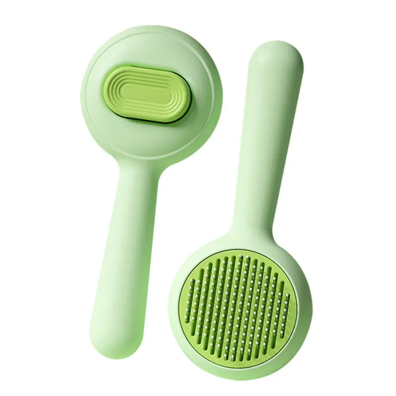 Green and yellow stainless steel pet grooming brush with a non-slip handle for hair removal.