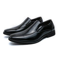 Men's black pointed patent leather casual shoes with flat rubber sole and low tube sock.