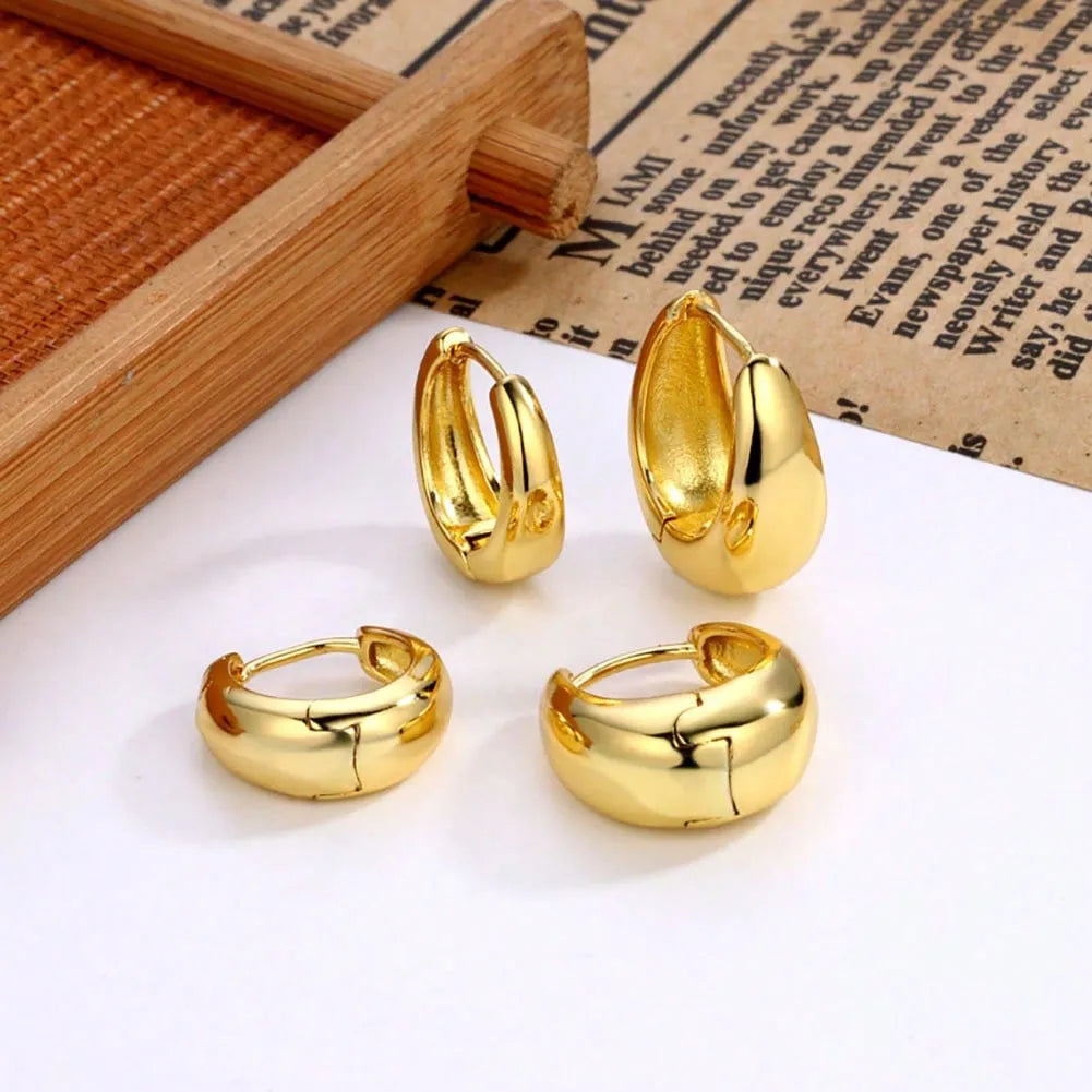 Gold electroplated copper geometric ring earrings for women, shown as a single pair or three-pair set.