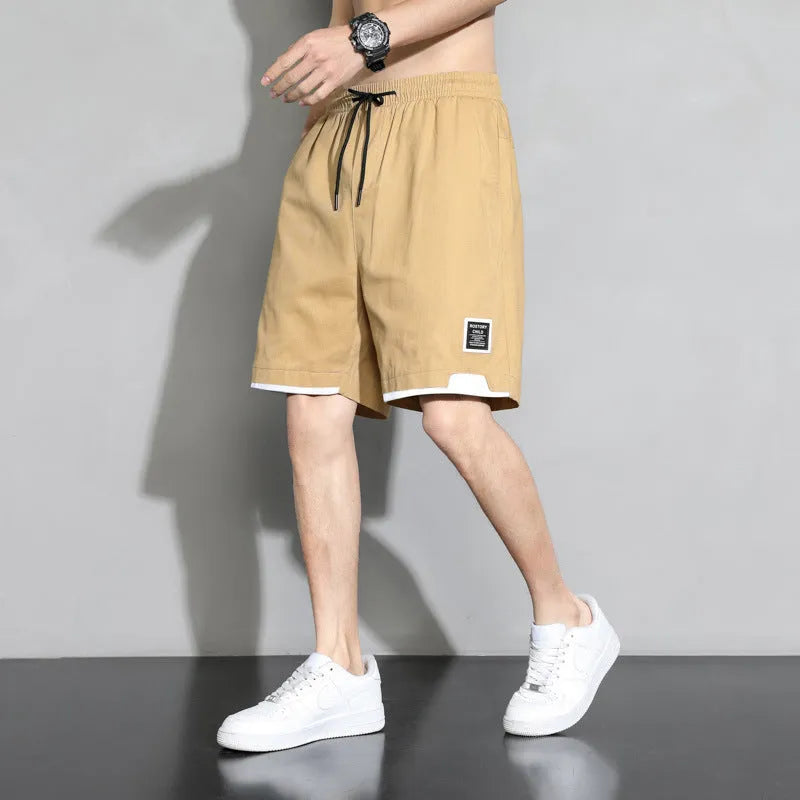 Cotton shorts for teenage boys in black, khaki, and white, showing mid-waist fit and shorts length.