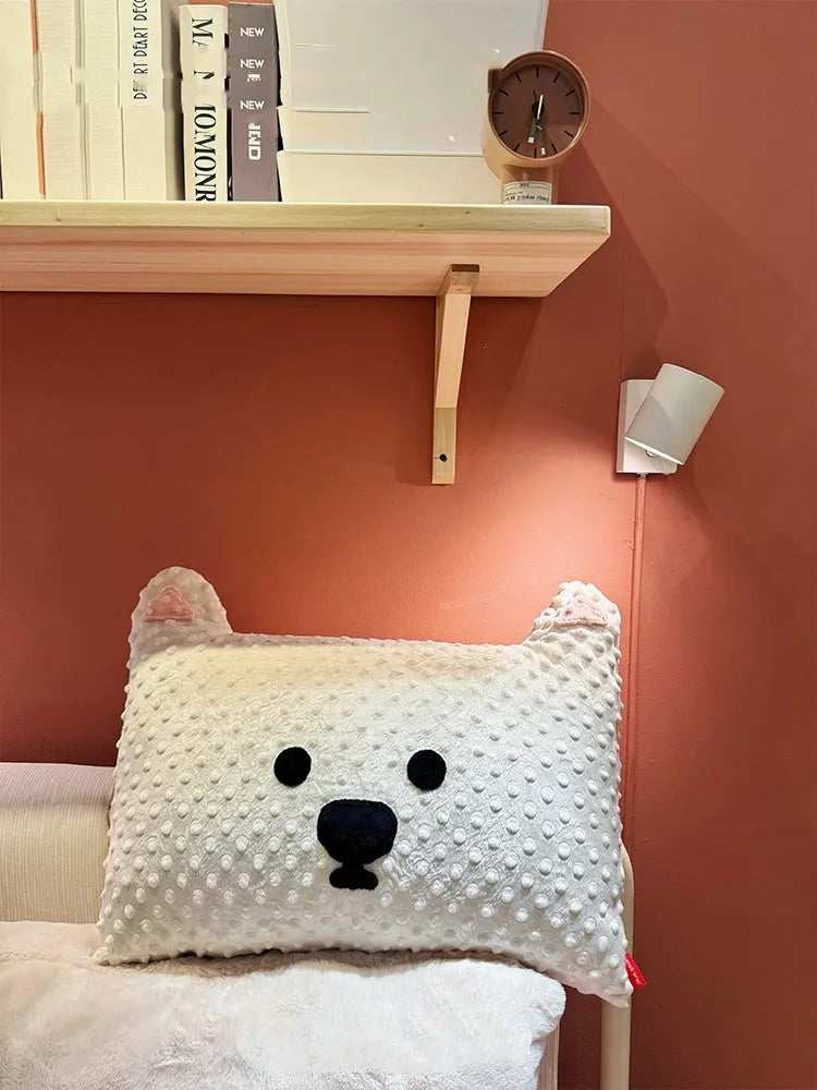 Grey and white West Highland puppy decorative cushion on sofa