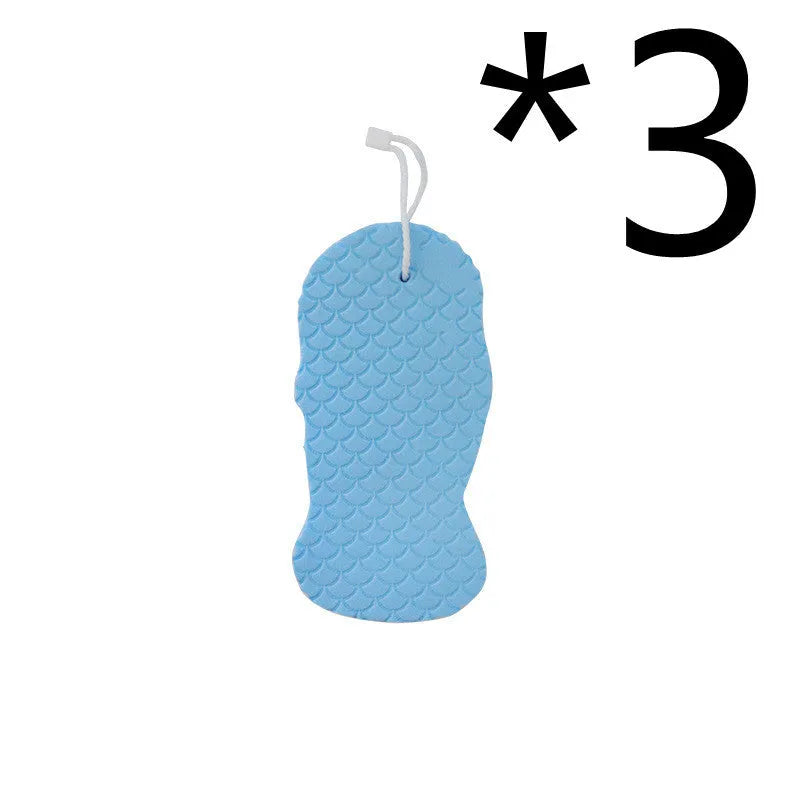 White 3D fish scale pattern bath sponge ball with hanging loop on a grey background.