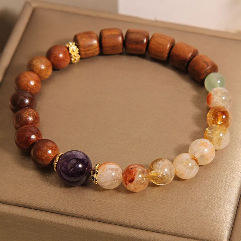 Women's bracelet with yellow tower crystal, ebony amethyst beads, pearl and rhinestone accents
