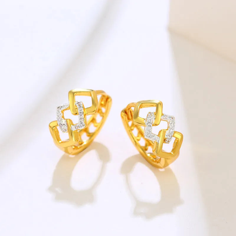 Gold geometric hollow-out earrings with electroplated finish and ear clip fastening