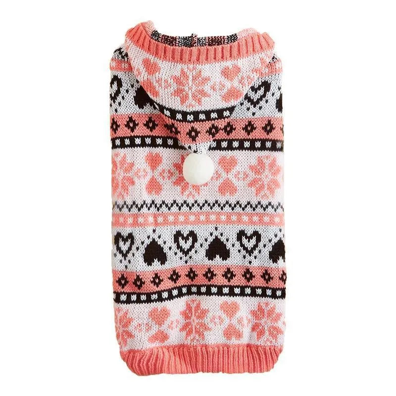 Colourful knitted dog sweater with snowflake and love heart patterns on a striped background.