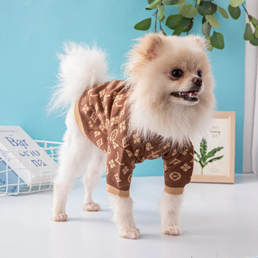 A thick wool dog sweater shown in a monochrome colour, sized for a medium dog.