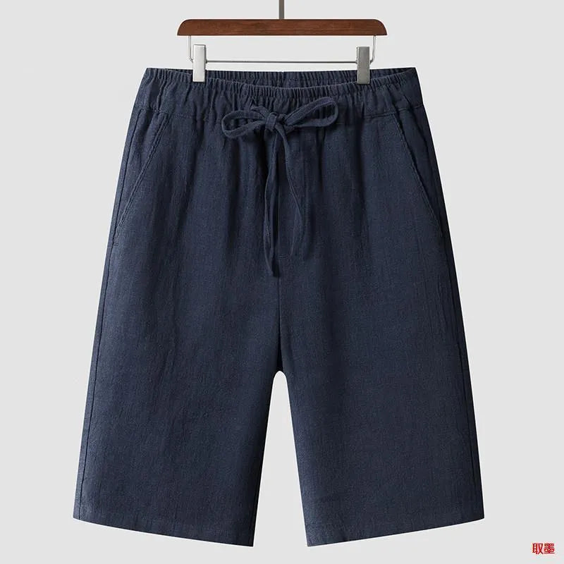 Men's loose-fit linen shorts in cropped length with elastic waistband