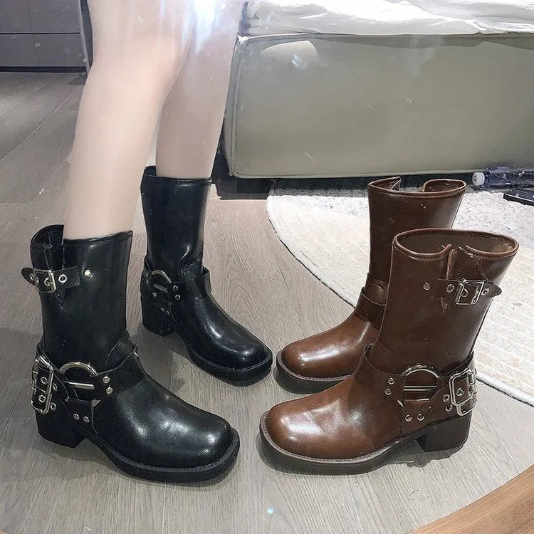 Women's black platform boots with buckle detail and mid-calf length