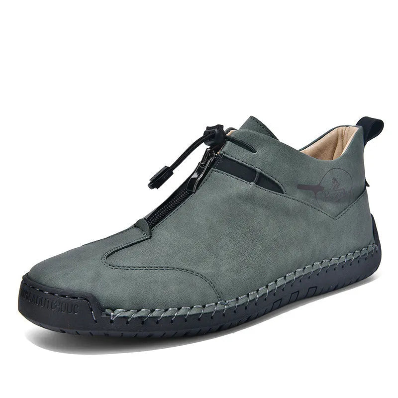 Men's casual leather shoe in green with round toe, mid-heel, and visible sewing thread detail.