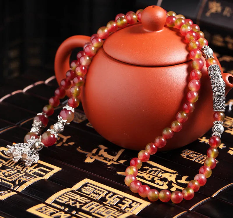 Handmade watermelon crystal bracelet with Chinese knot and elephant beads in 6mm or 8mm size.