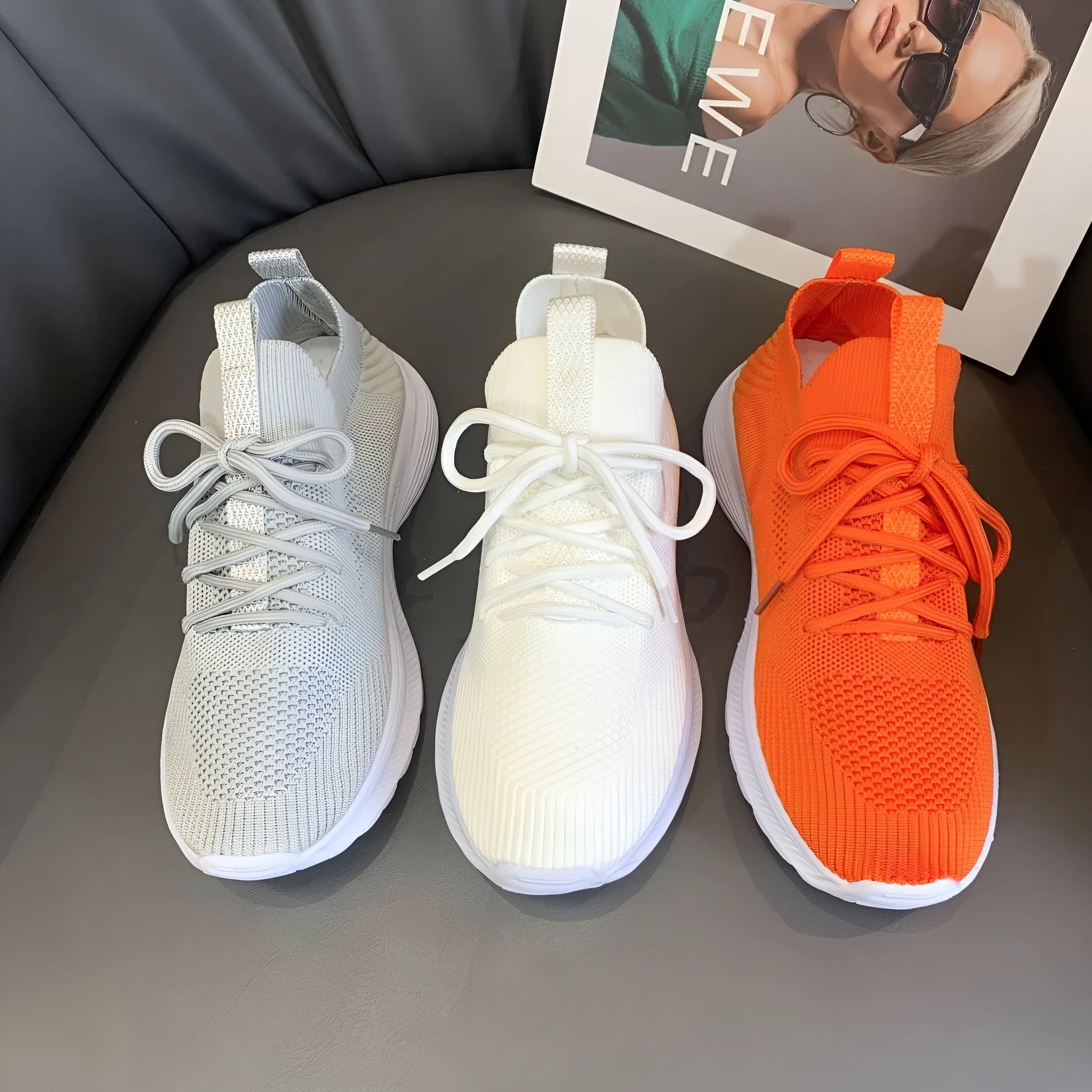 Women's mesh running shoes in creamy white with Flyknit upper and rubber sole