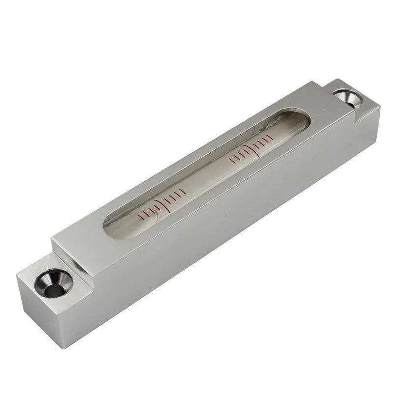Small metal-bodied spirit level with glass vials, measuring 132mm in length.