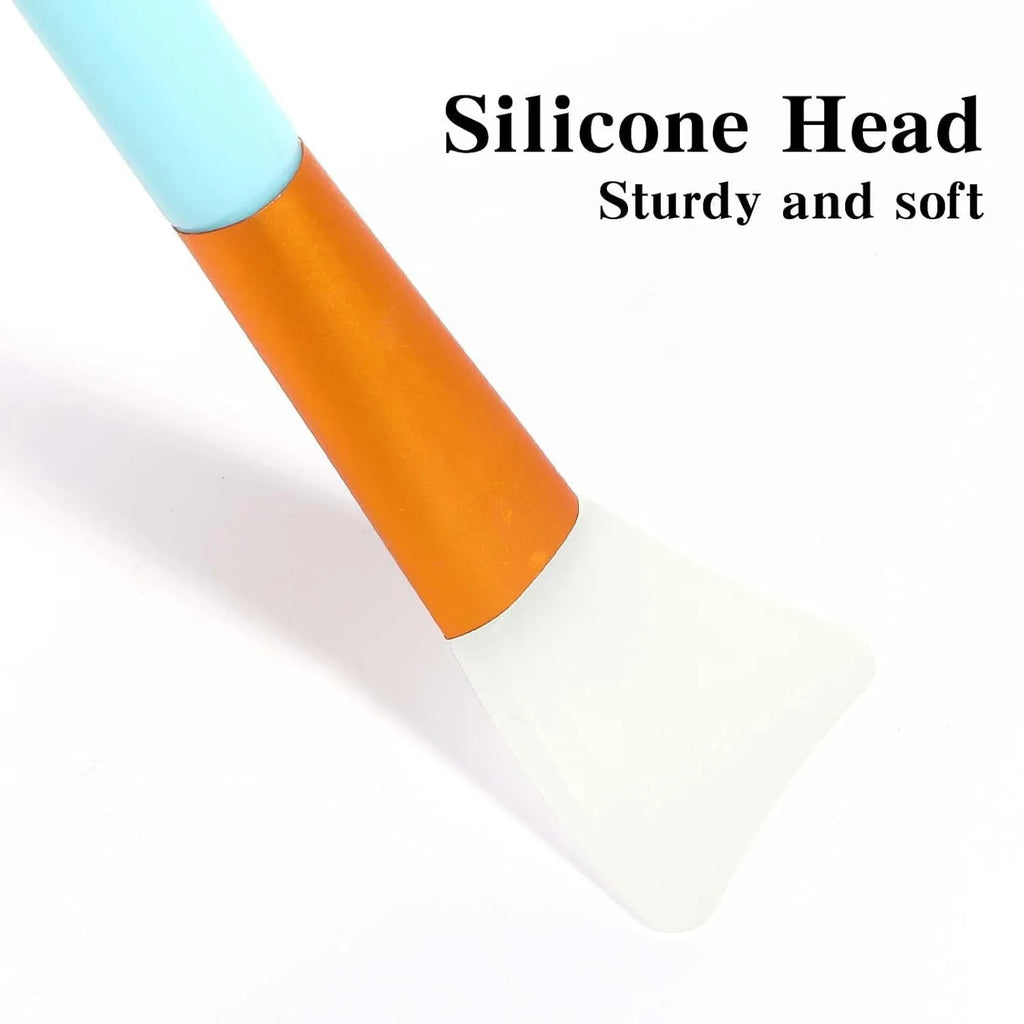 Reusable silicone face and body mask applicator spatula in various colours.