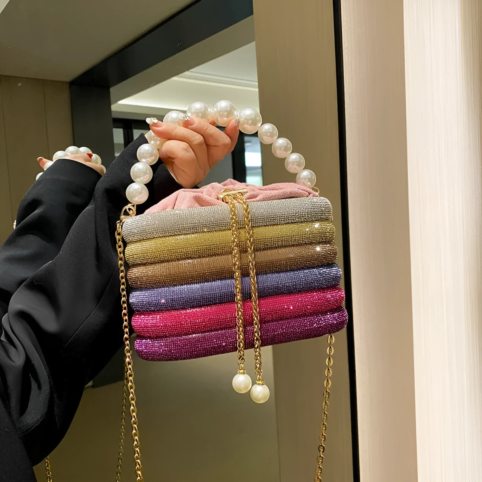 Soft round retro-style women's crossbody bag with bead details in gold colour.