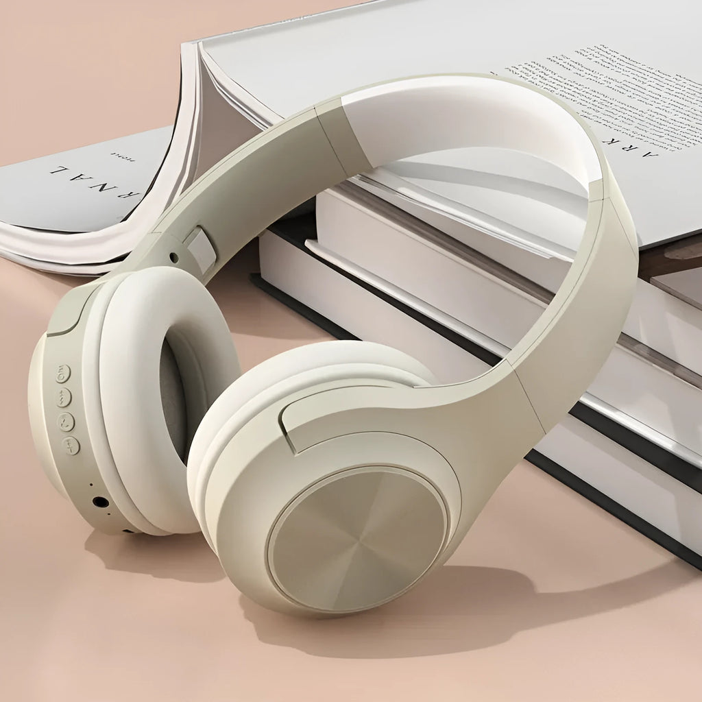 Wireless Bluetooth headset in ivory white, chalk black, or youth green colours showing head-mounted design and plastic construction