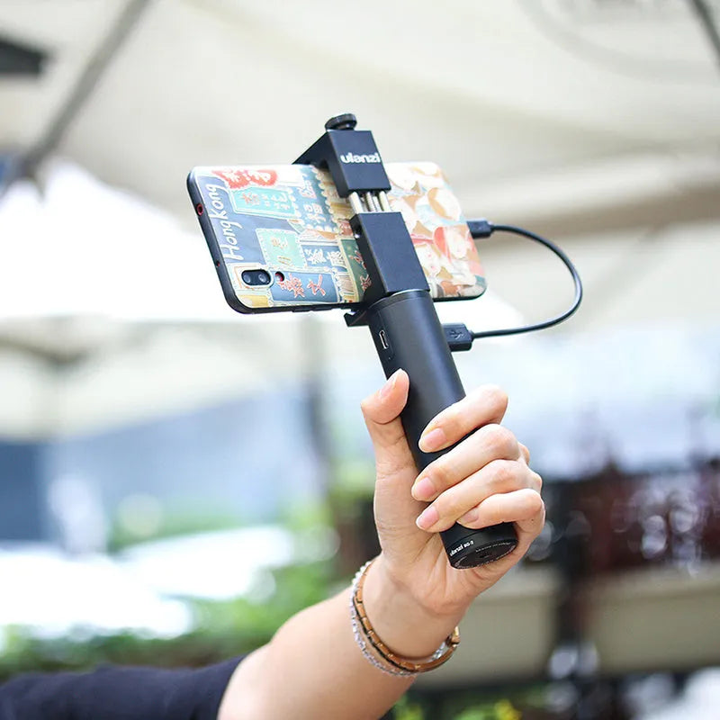 Black aluminium alloy power bank with an integrated handle, showing its compact size and Type C port.