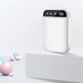 Compact mini power bank in black, blue, pink, or white with multiple USB ports