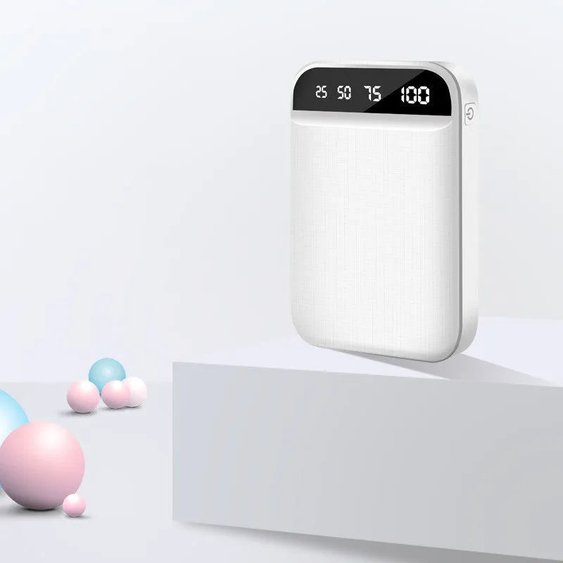 Compact mini power bank in black, blue, pink, or white with multiple USB ports