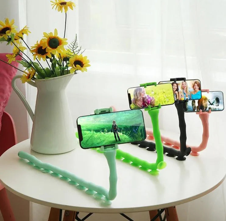 Flexible rubber phone bracket with suction cup showing 360° rotation capability