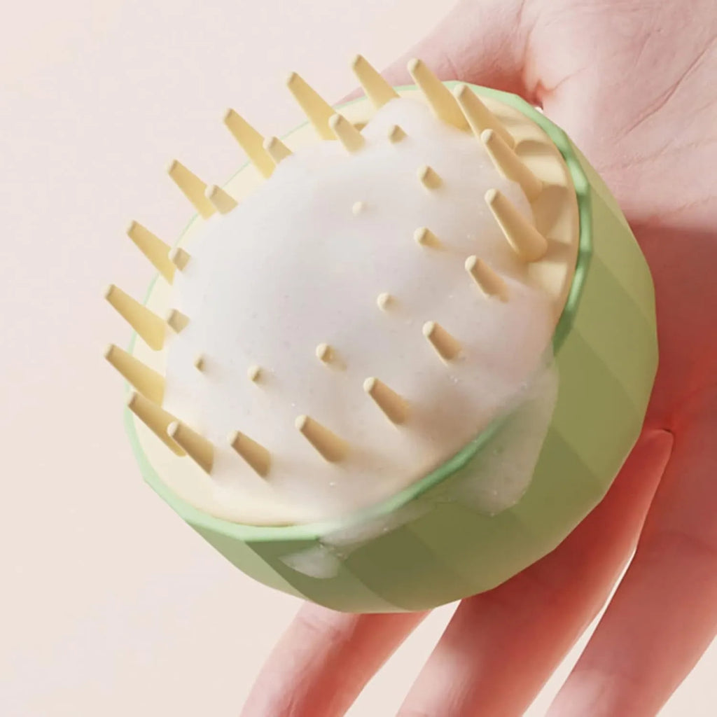 Green pet bath massage brush with silicone bristles and drainage holes