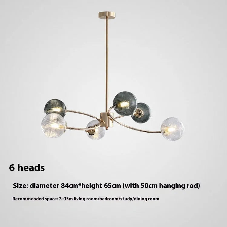 Modern Nordic style pendant chandelier with multiple heads, shown at an adjustable height.