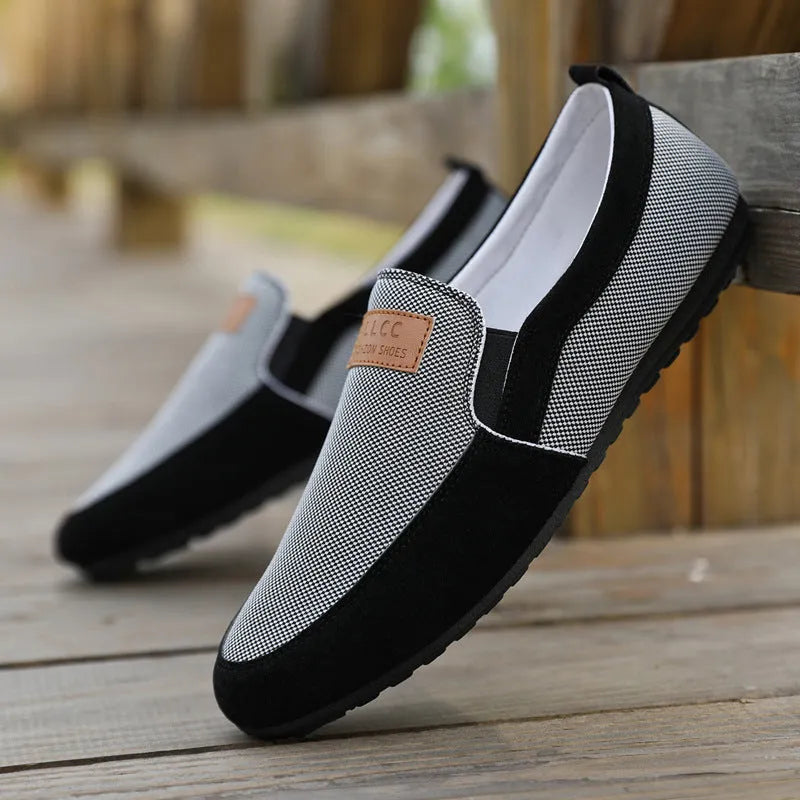 Men's grey canvas board shoes with round toe and sewing thread detail on cotton-lined upper