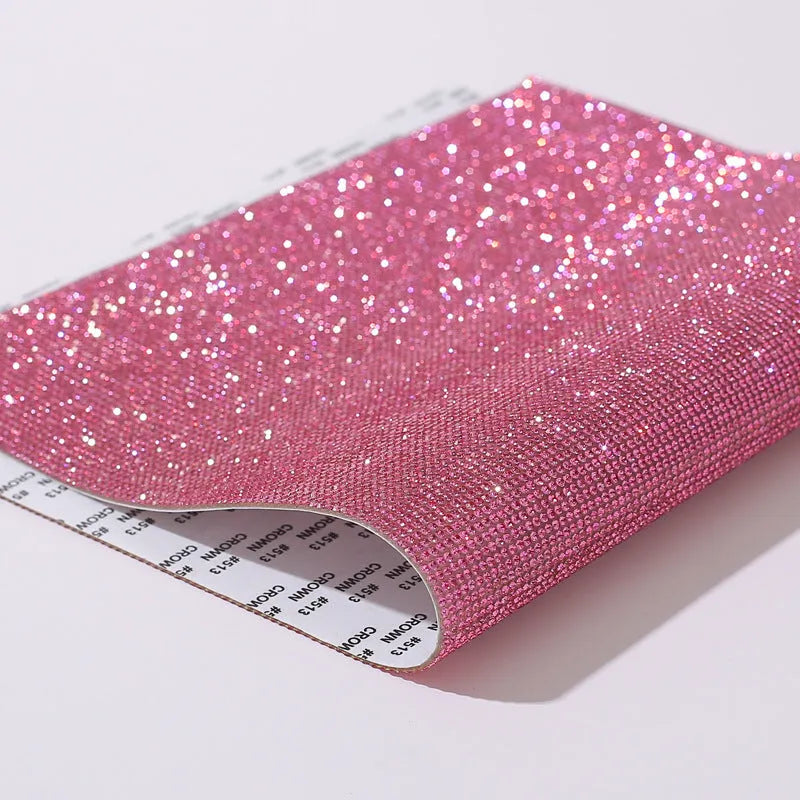 Rhinestone sticker sheet in eight eyes pattern showing electroplated crystals on adhesive backing