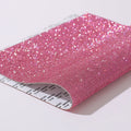 Rhinestone sticker sheet in eight eyes pattern showing electroplated crystals on adhesive backing