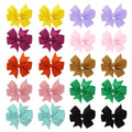 Assorted colour 3-inch grosgrain ribbon hair bows on alligator clips for toddler girls.