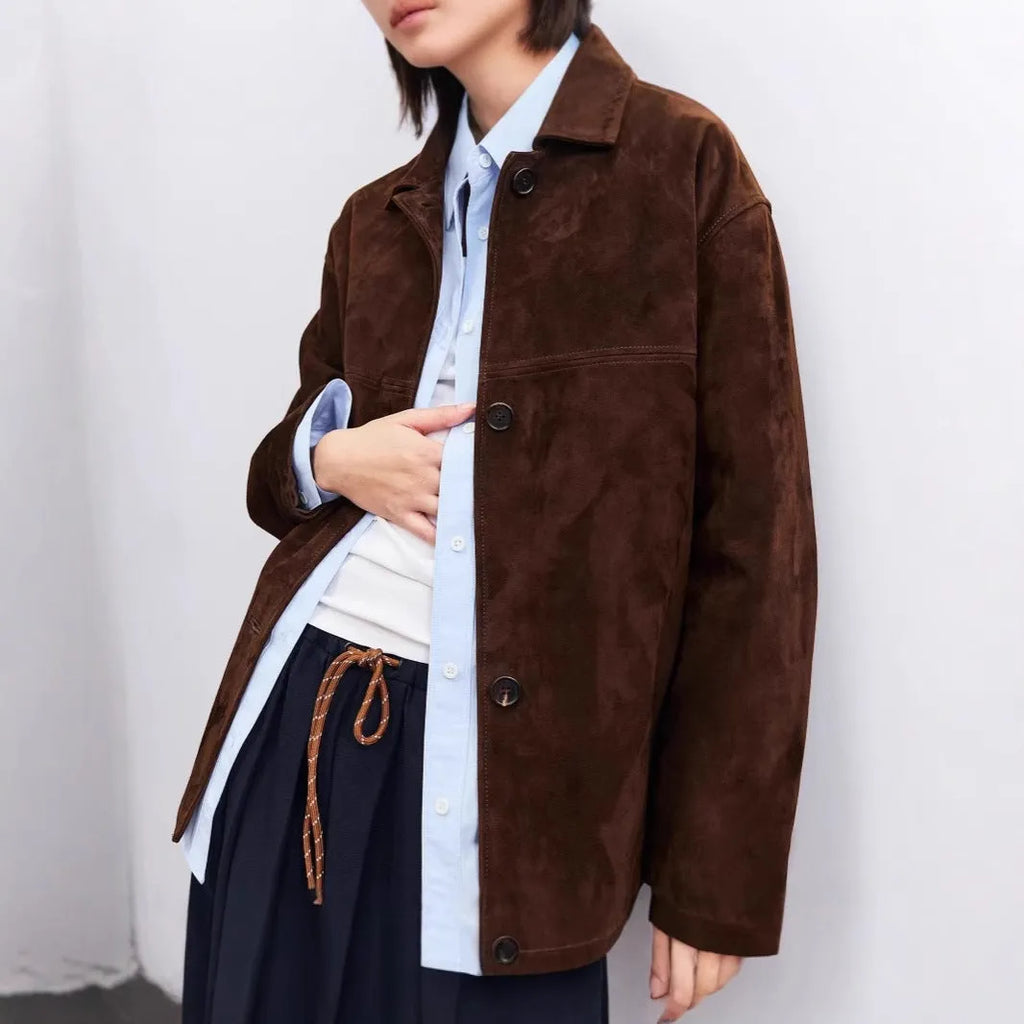 Mid-length yellow brown cashmere coat with leather stitching and Peter Pan collar